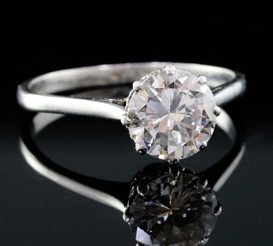 A platinum and solitaire diamond ring, size S.